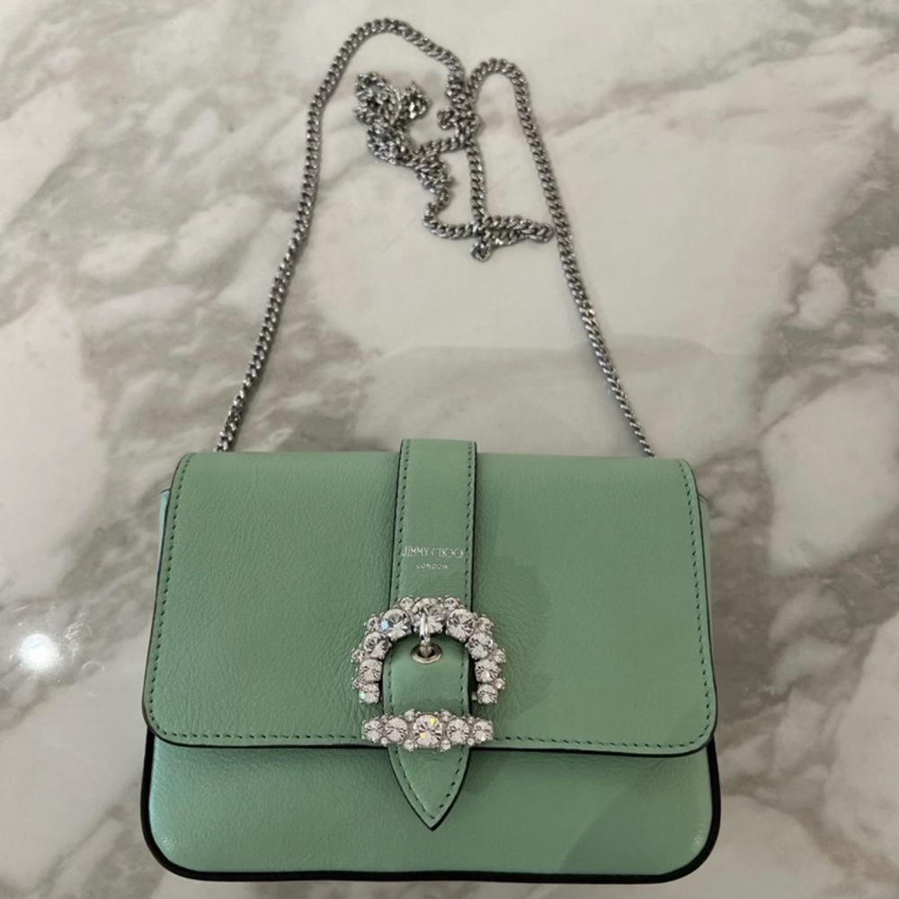 Brand new super cute Jimmy choo purse. Firm price.